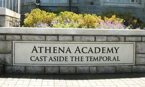 The sign for the Athena Academy, located near the walkway.