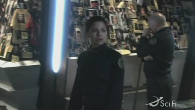 Kat with mourning crewmember in the background (TRS: "Scar").