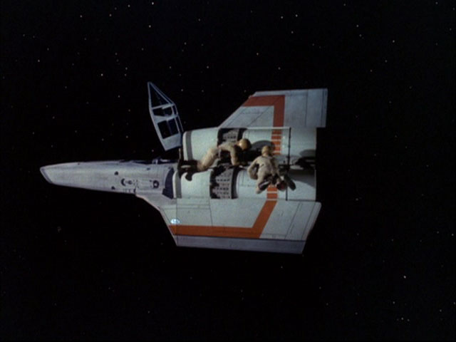 An external view of the Viper in space, undergoing field repairs (Spaceball).