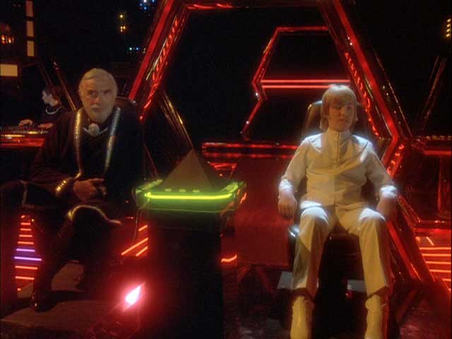 Doctor Zee and Adama on the bridge of the anti-gravity ship (1980: "Space Croppers").