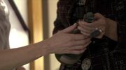 Thumbnail for File:Caprica - The Imperfections of Memory - Clarice Willow Gifts Amanda Graystone a Bottle of Scorpion Marsh Genuine Ambrosia.jpg