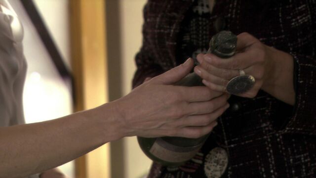 File:Caprica - The Imperfections of Memory - Clarice Willow Gifts Amanda Graystone a Bottle of Scorpion Marsh Genuine Ambrosia.jpg