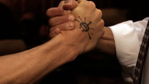 Adama brothers shake hands, 1x15.jpg