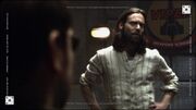 Thumbnail for File:BSG-TRS - The Son Also Rises - Gaius Baltar in Front of Viper Weapons School Plaque- 906.jpg