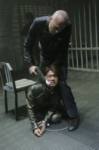 Tigh brutalizes Valerii during her interrogation.