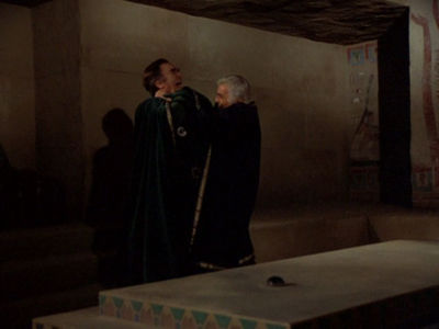 Adama greets Baltar with open hands.