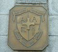The plaque depicting the motto of the Athena Academy.