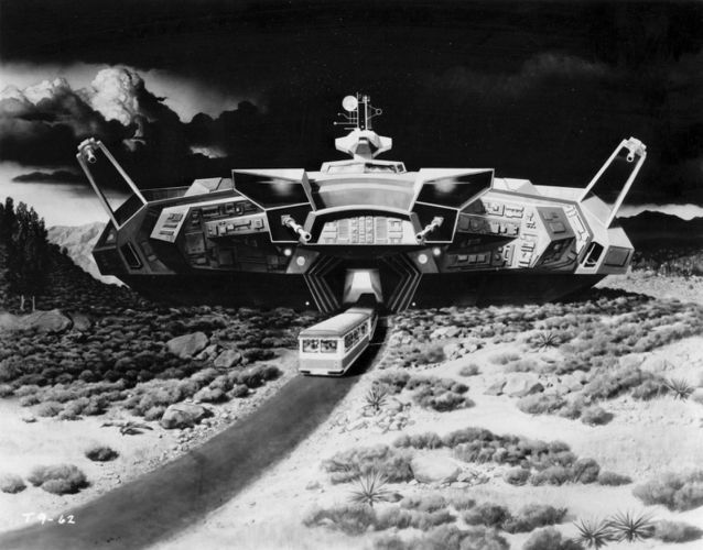 Artwork depicting the Cylon battle cruiser that, having landed on Earth, is discovered by the tourists on the Universal Studios Tour's Glamtram. The tram drives into the open maw of the ship. Absent is the Cylon tank that would force the tour guide to make that decision.