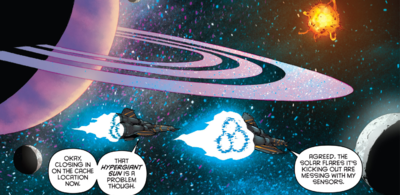 Apollo and Starbuck happens across Q-Cache #7202 in an alternate reality, believing it to be Q-Cache #2702. The cache is located on the moon (right) around a ringed planet, with its supergiant sun in the background (Classic Battlestar Galactica Vol. 2 #2).