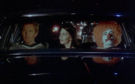 Norman Blore driving his wife and two Cylons to a costume party (The Night the Cylons Landed, Part I).