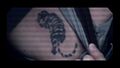Gaeta's tiger tattoo.