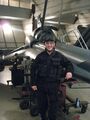 Photo of Garrett Reisman as "Marine #3" posing in front of a Viper Mark VII on Galactica's hangar deck in "Daybreak, Part II."