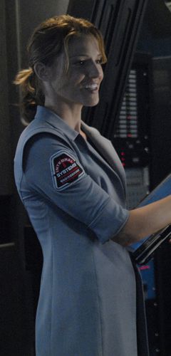 Gina Inviere in a female systems analyst uniform (TRS: "Razor").