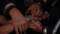 Adama wraps the Seal of the Lords around the joined hands of Apollo and Serina.