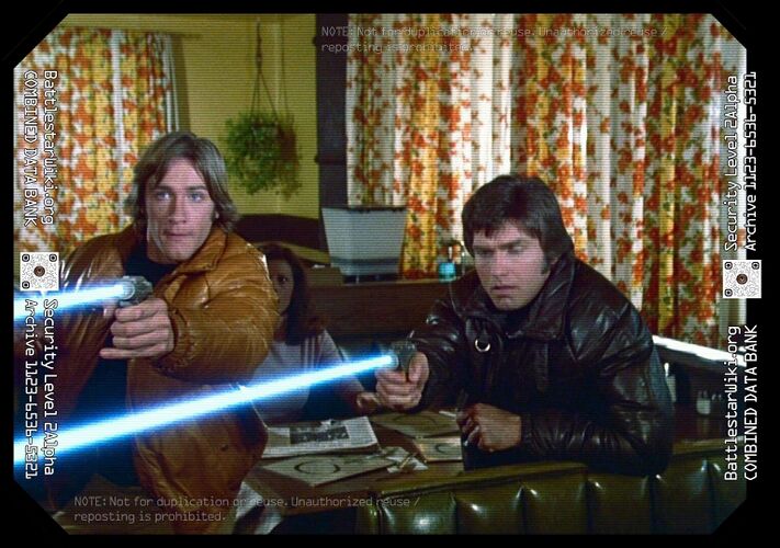 Dillon and Troy fire their smaller laser guns at an offending jukebox at Maggies Truck Heaven (Galactica Discovers Earth, Part III).