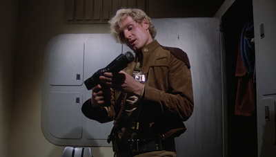 Inside of a locker room on Rising Star, where Ortega changes into his uniform and checks his laser pistol before being slain in "Murder on the Rising Star."
