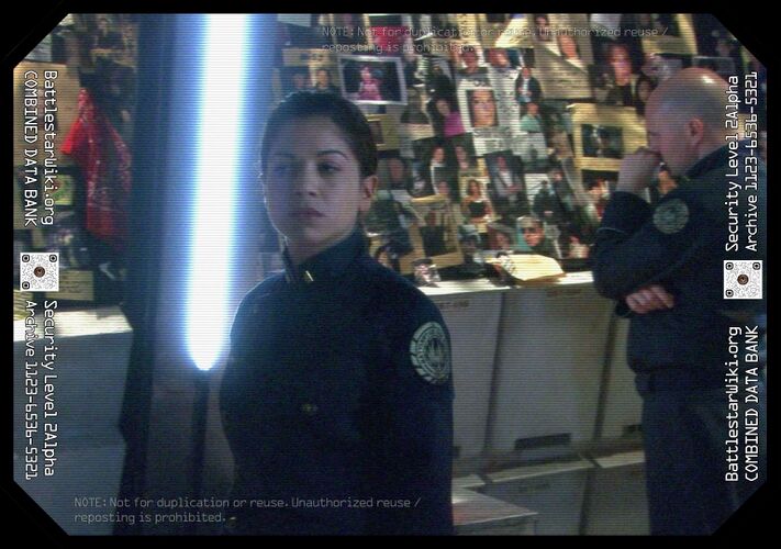 Kat with mourning crewmember in the background (TRS: "Scar").