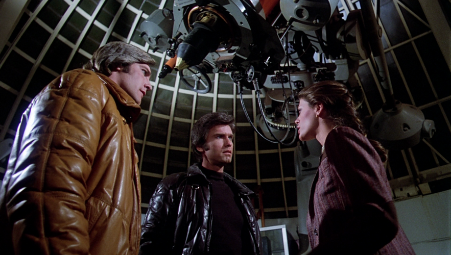 Jamie Hamilton talking to Troy and Dillon inside of the Griffith Park Observatory's Zeiss telescopes room.