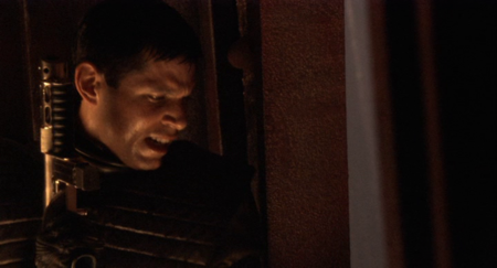 William Adama with a Cylon sub-machine gun while in an unnamed ice planet's Cylon facility during Operation Raptor Talon.