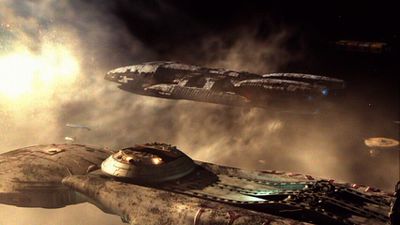 Galactica and Astral Queen at the edge of the star cluster (TRS: "The Passage").