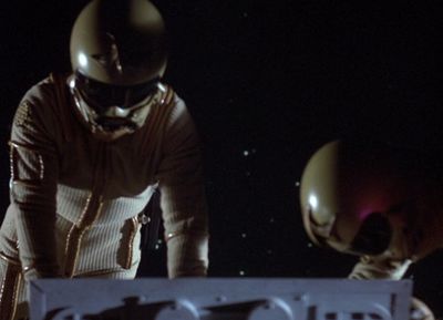 Dillon and Troy effect repairs on their Viper while in their environmental suits (1980: "Spaceball").