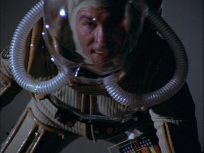 Apollo in a Colonial space suit placing charges on Galactica's outer hull (TOS: "Fire in Space").