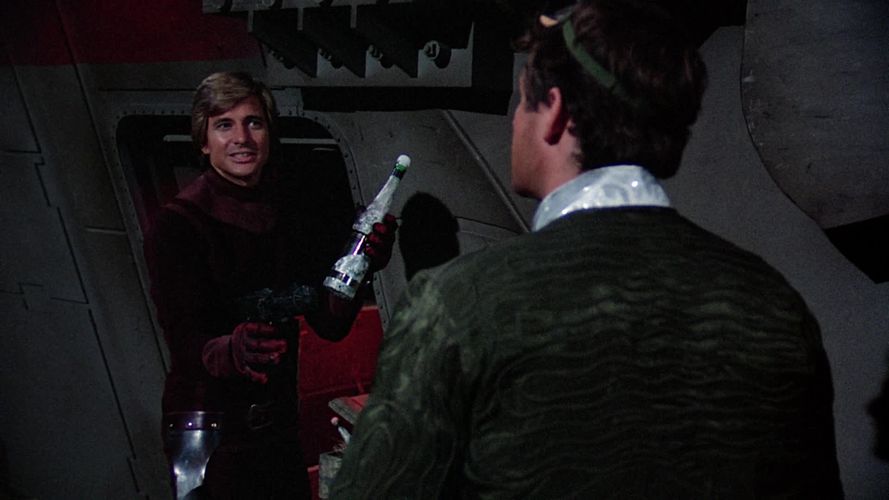 Starbuck with a 500 yahrens-old bottle of ambrosa from Proteus (TOS: "The Long Patrol").