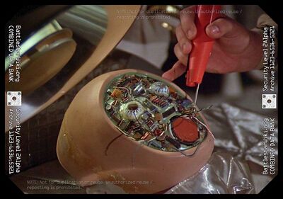 A technician aboard Galactica working on an android head (TOS: "War of the Gods, Part I").