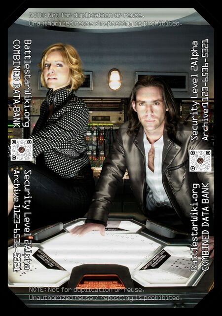 Maxim photo shoot featuring Tricia Helfer and James Callis in Galactica's weapons room.