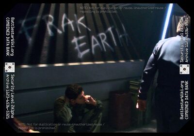 William Adama walks by "Frak Earth" graffiti on a bulkhead (TRS: "Sometimes a Great Notion").