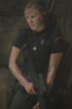 Kara Thrace with a stripped down version of attack gear. Note the shirt with the emblem over the left breast (TRS: "Razor").