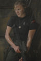 Kara Thrace with a stripped down version of attack gear. Note the shirt with the emblem over the left breast (TRS: "Razor").