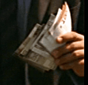 Wad of cash with possible 10 and 100 cubit notes visible.gif